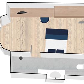 A clear floor plan drawing of a room with a bed, a table, and a bathroom. The floor is made of light wood, and the walls are white.