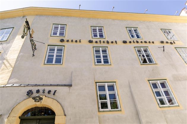 A hotel building named "Hotel Gaistal" on the wall. The facade is bright with several windows and an entrance.