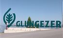 A large green inscription with the word "GLUNGEZER" stands on a mountain. In the background, mountain landscapes are visible.