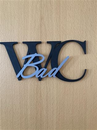 A sign with the inscription "WC Bad". The letters are designed in two colors.