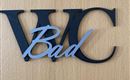 A sign with the inscription "WC Bad". The letters are designed in two colors.